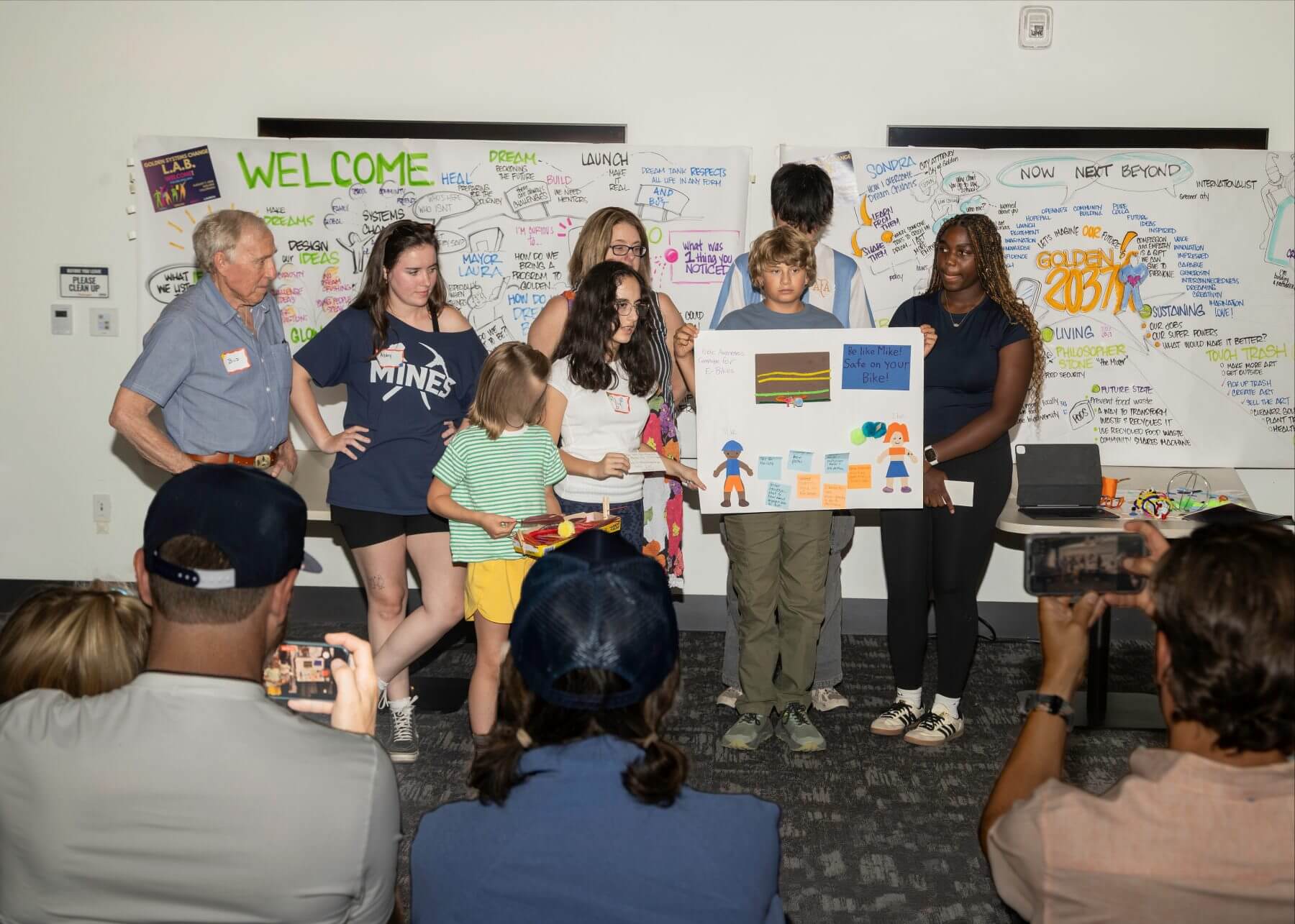 Two intergenerational teams present their right-of-way approaches to a room of civic leaders in Golden on August 7.